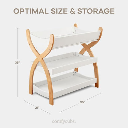 Comfy Cubs Baby Changing Table - Sturdy Wood Construction, Timeless Look Baby Change Table with Two Open Shelves for Infant Daycare Essentials Storage - White with Natural Wood Legs